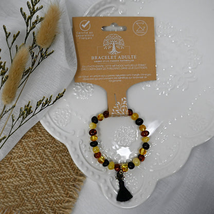 Bracelet adulte - Ambre multicolore, pompon noir et lotus or